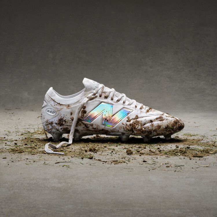 The white cleats with blue accents with dirt on them.