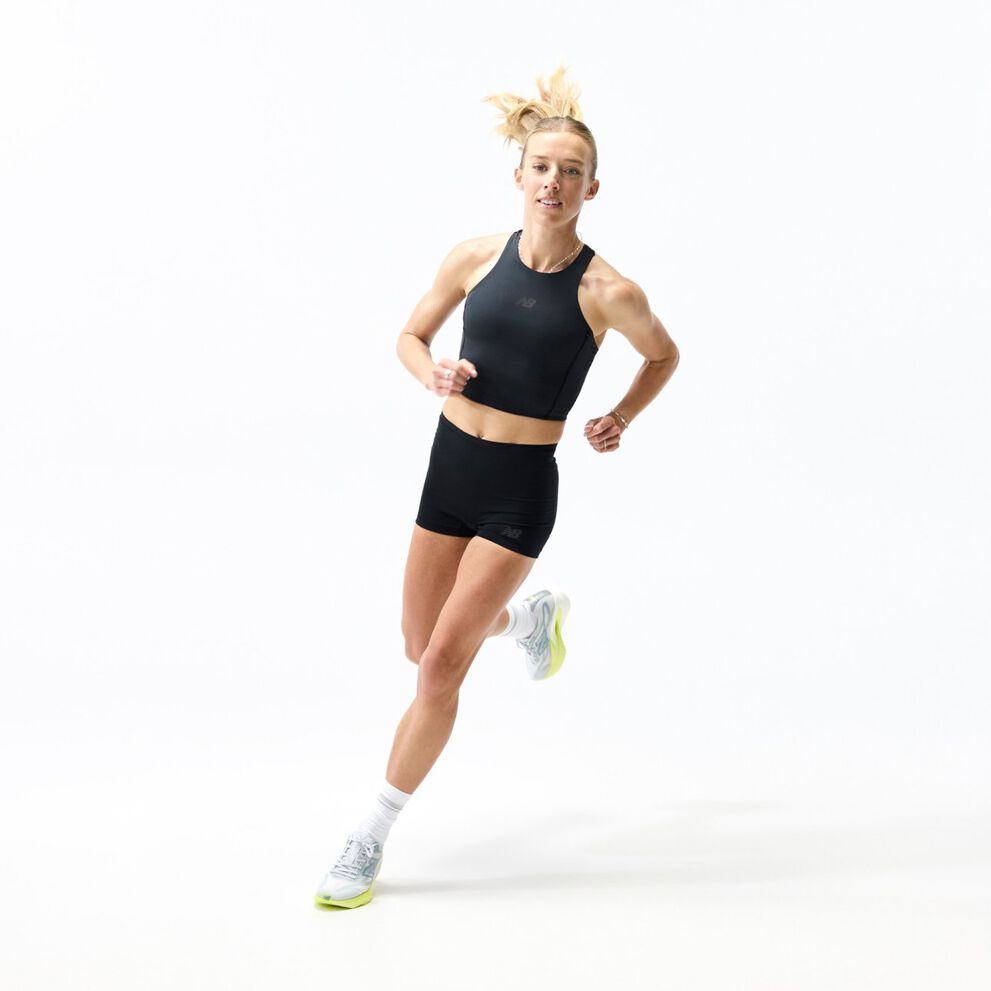 Person running in a studio wearing a black athletic outfit and light gray New Balance running shoes with lime-green soles, shown alongside a close-up of the shoe&rsquo;s cushioned midsole design.