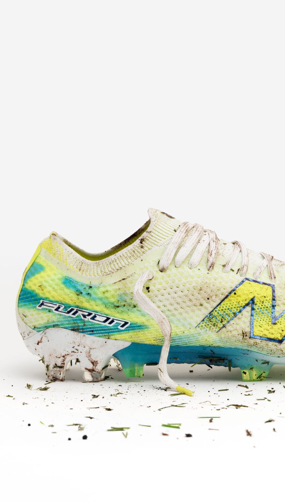 Lateral view of a muddy Furon boot.