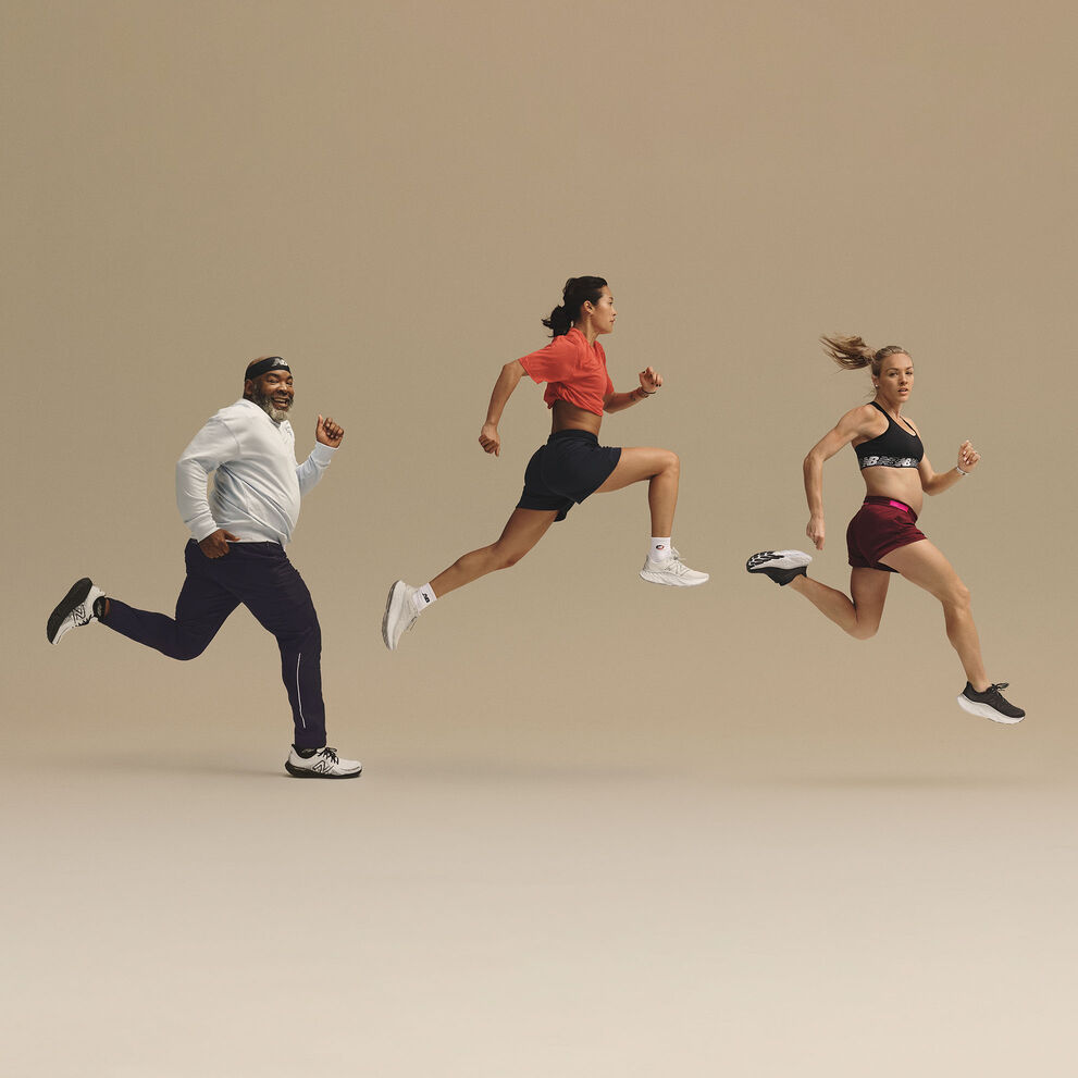 Five men and women in various running poses forming an arc in front of a beige studio backdrop 