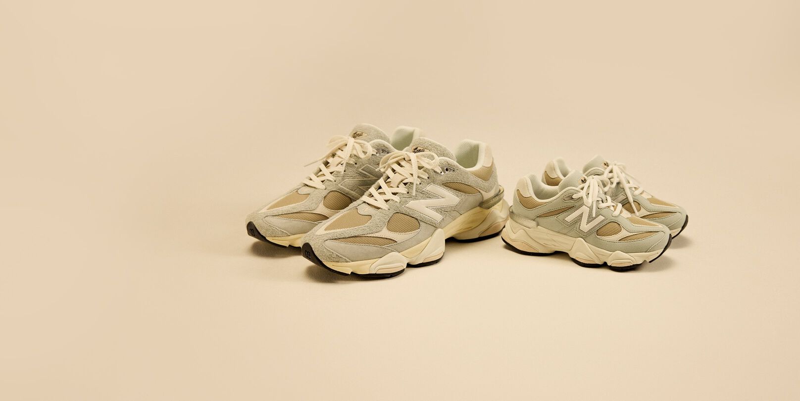 Adult and kids shoes paired together on a cream background.