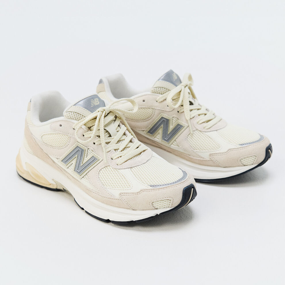 A pair of New Balance sneakers on a white background 