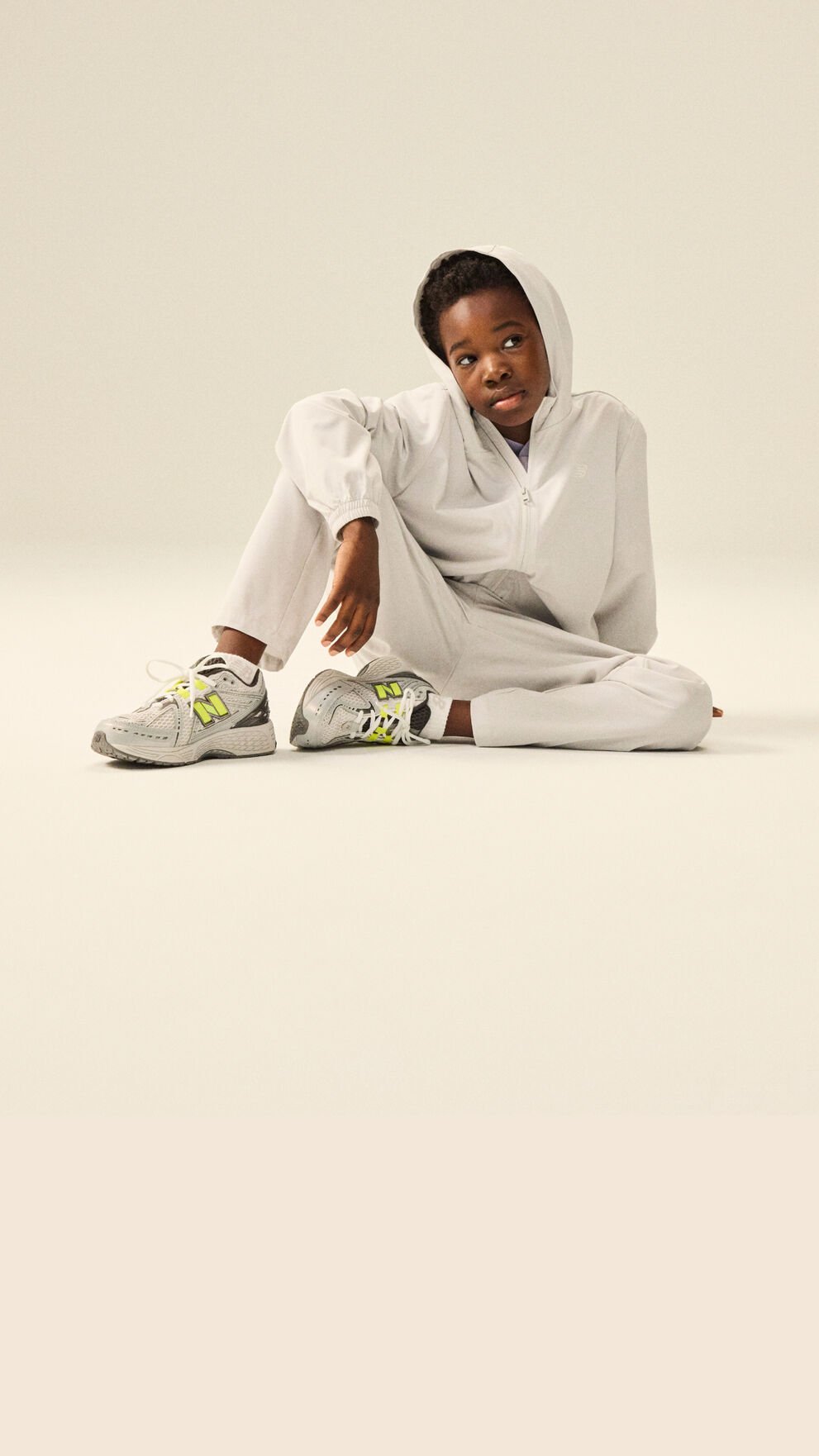 Boy wearing a pair of 1906 shoes and NB apparel.