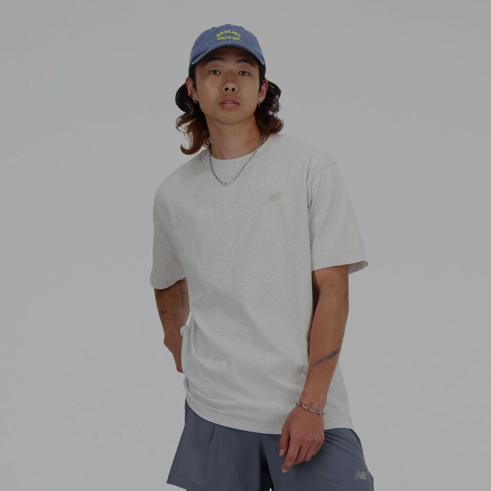 A man in a grey New Balance t-shirt.