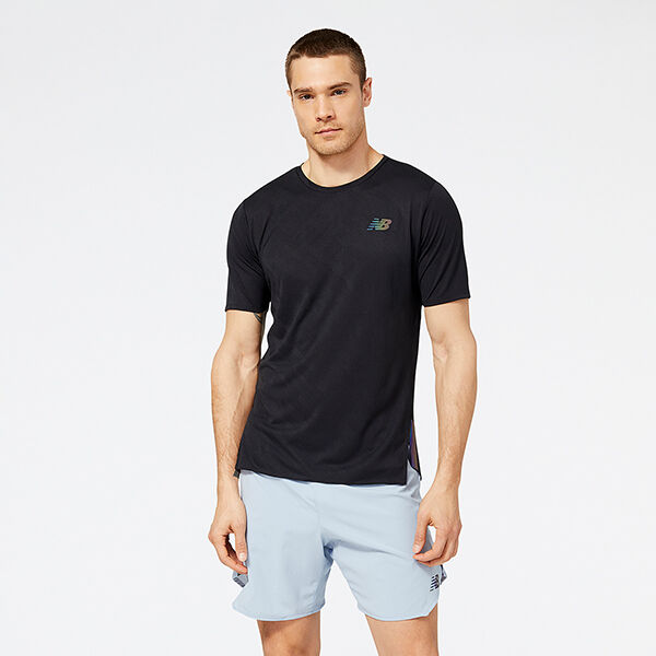 Man wearing a black NB short sleeve shirt and light-blue NB shorts
