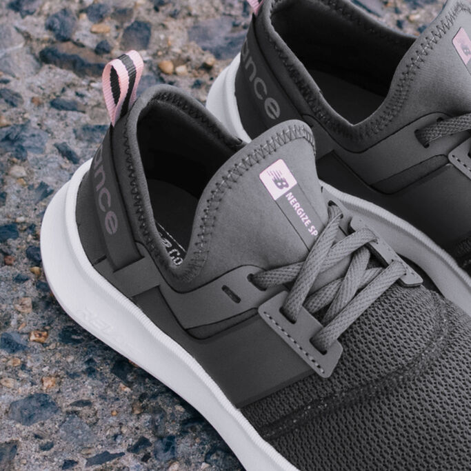 Close up of heel and laces of dark grey Nergize Sport women’s sneaker