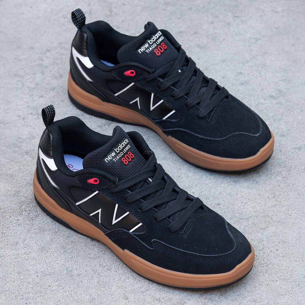 A pair of black and red Tiago 808 Lite shoes. 