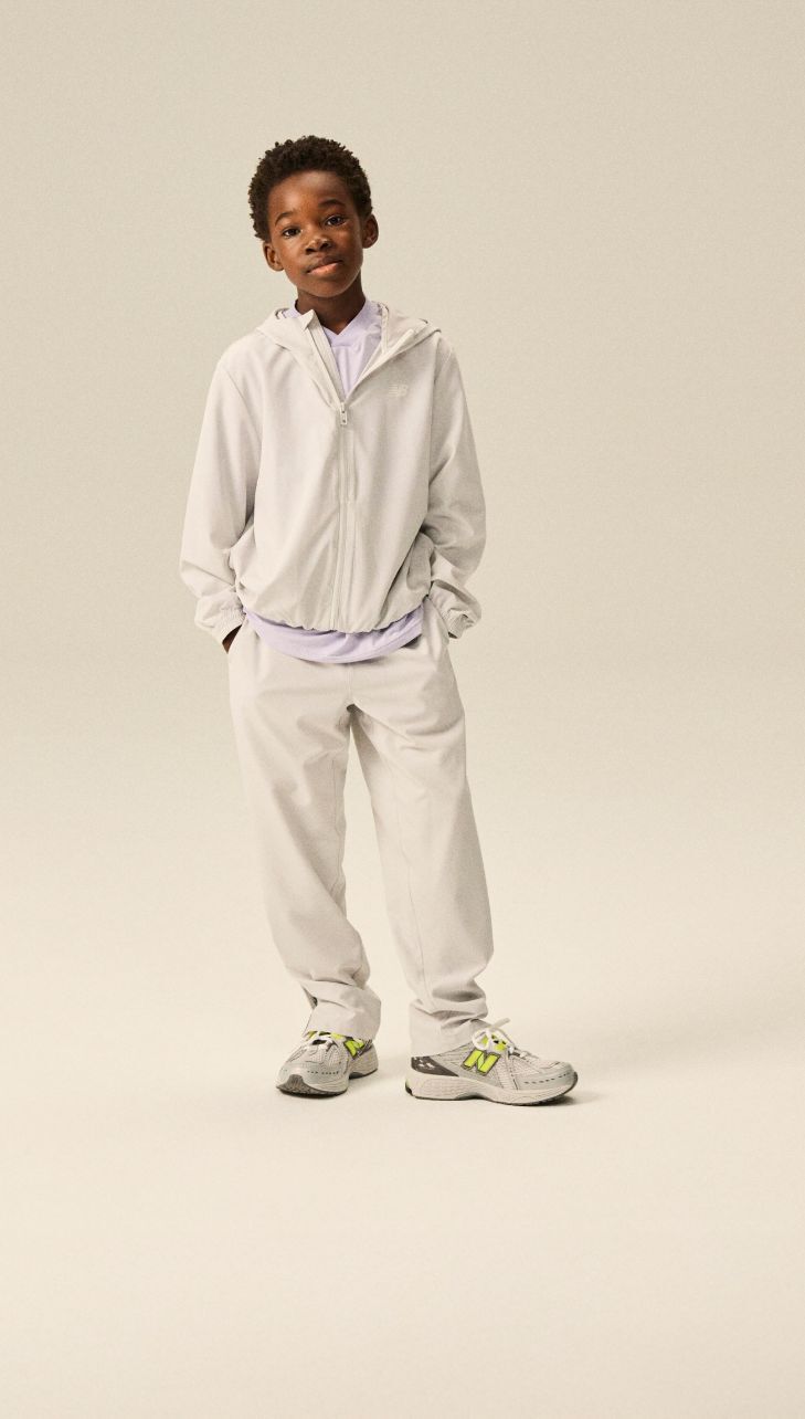 Boy wearing a pair of 1906 shoes.