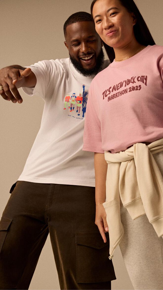 Man and woman wearing New York City Marathon apparel 