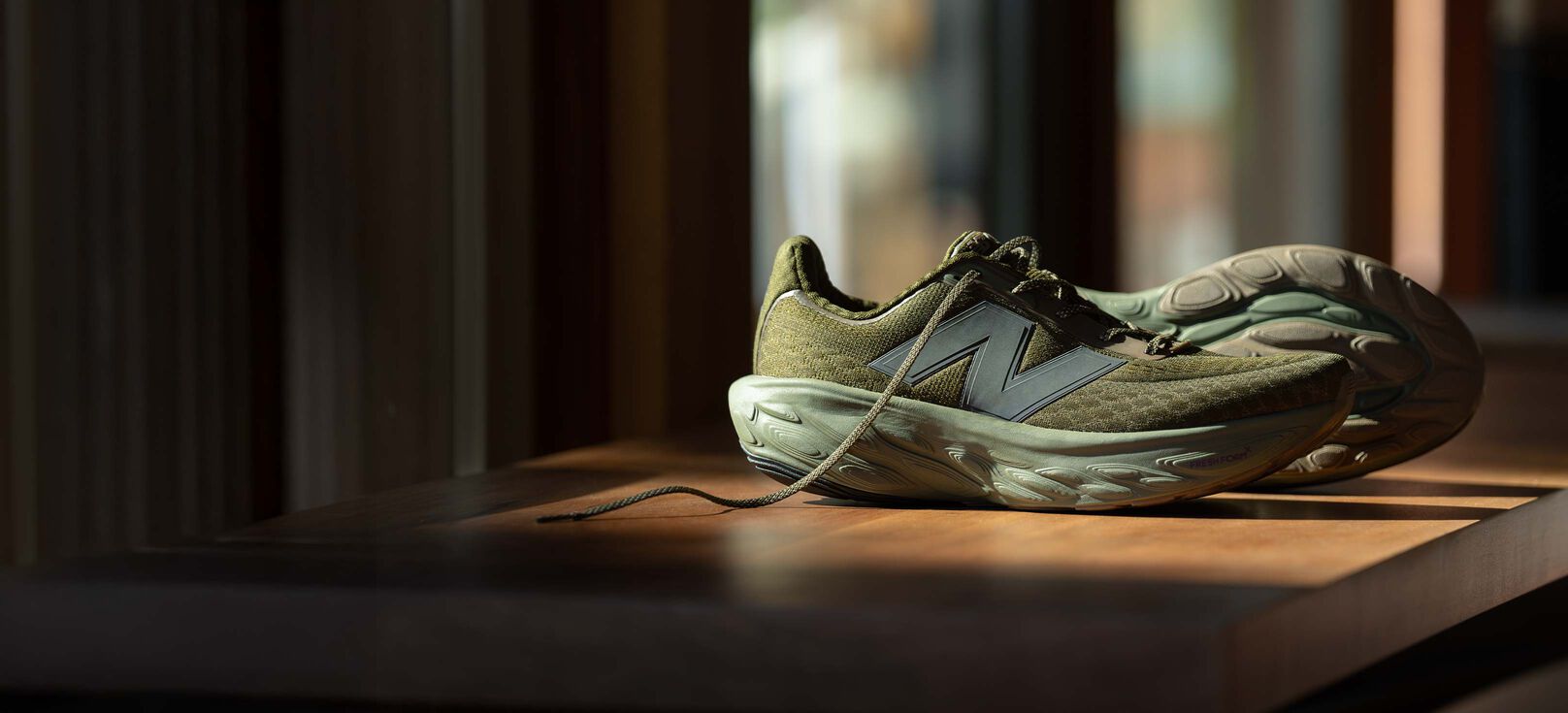 A pair of green 1080v14 shoes.