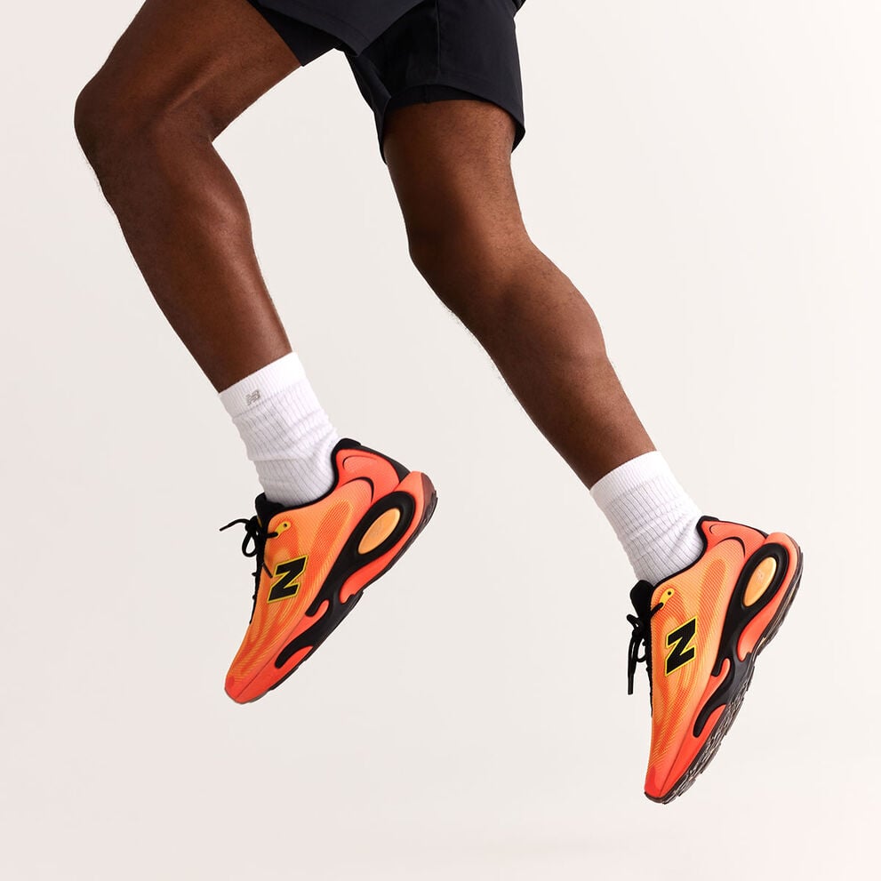 A hip down image of a person jumping in the air.