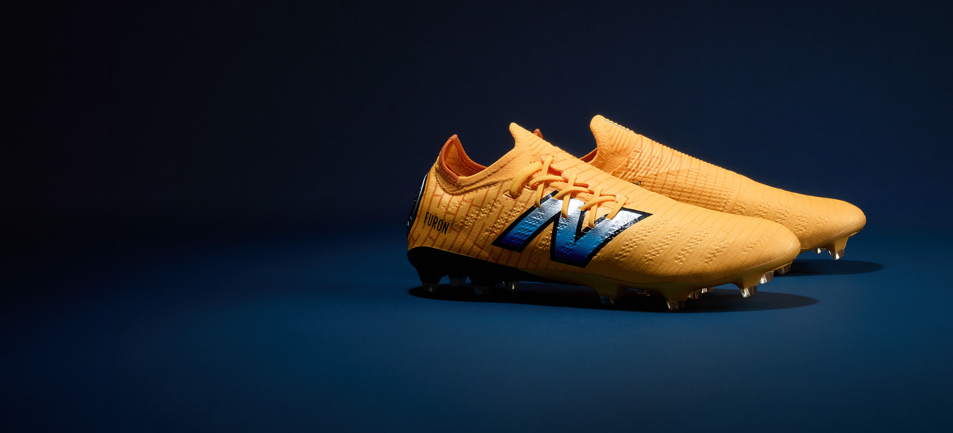 Tacos de futbol New Balance