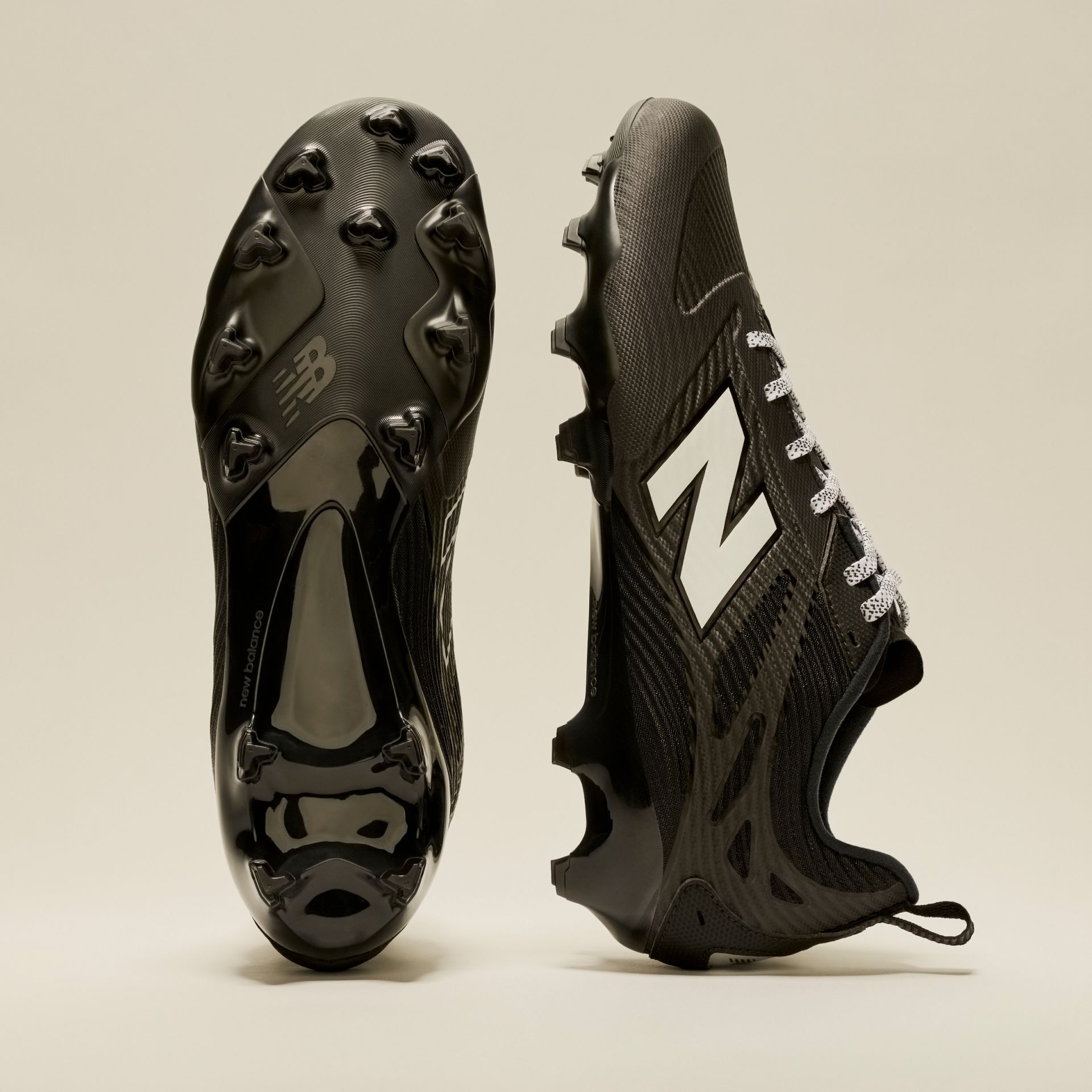 A pair of black Rev iQ shoes in studio.