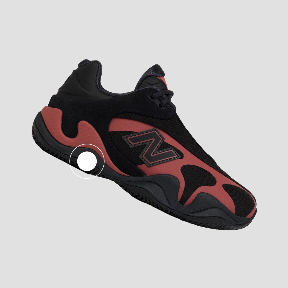 Black and light blue athletic sneaker with a prominent side logo, white laces, and a sculpted black sole shown in side profile on a light gray background.
