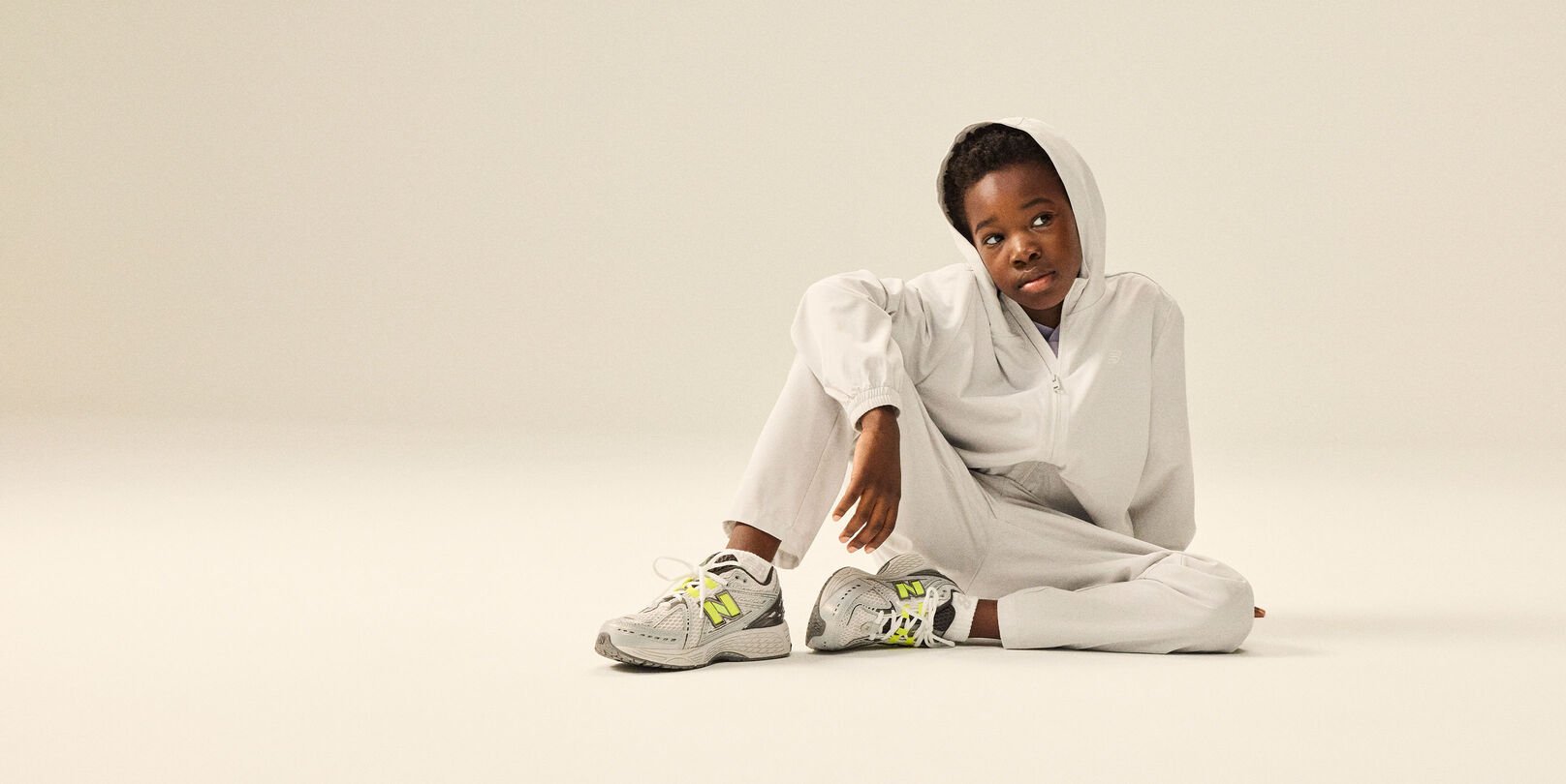 Boy wearing a pair of 1906 shoes and NB apparel.