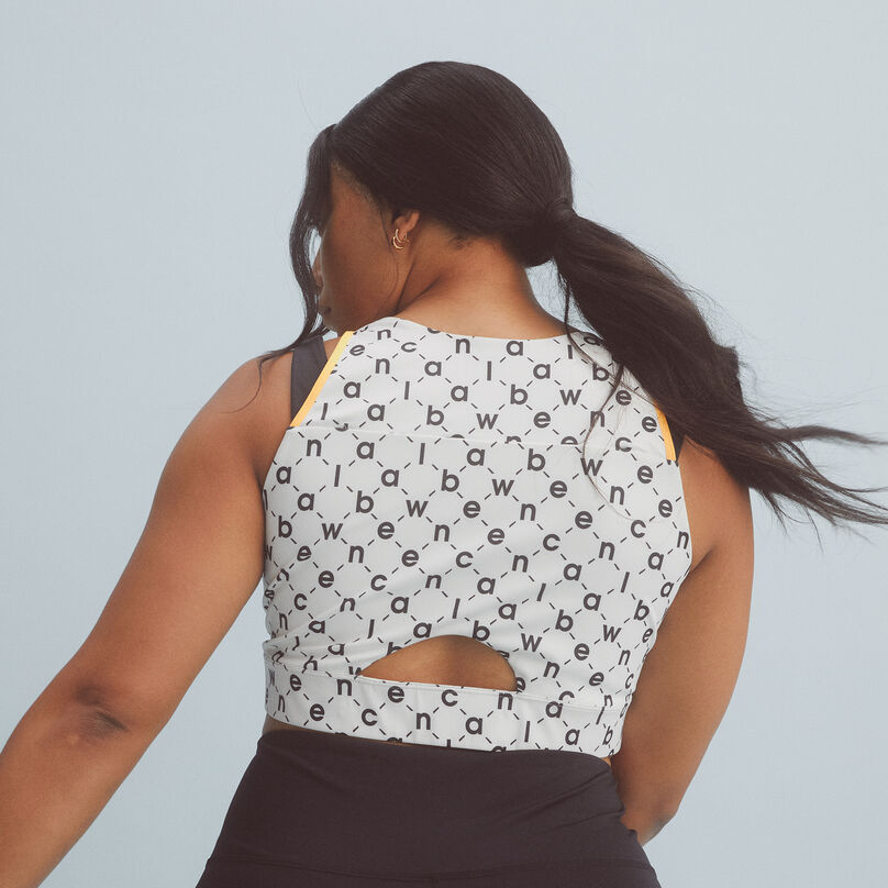 Woman with her back turned focusing on the crop.