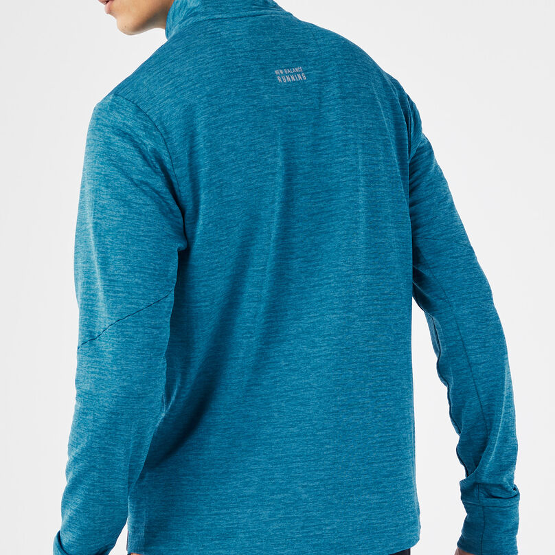 Male with his back turned showing the back of the shirt.