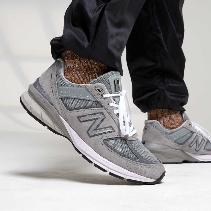 Grey 990 mens’ sneaker worn with colorful socks