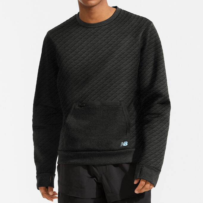Front view of a young man to show the front pocket of the pullover.