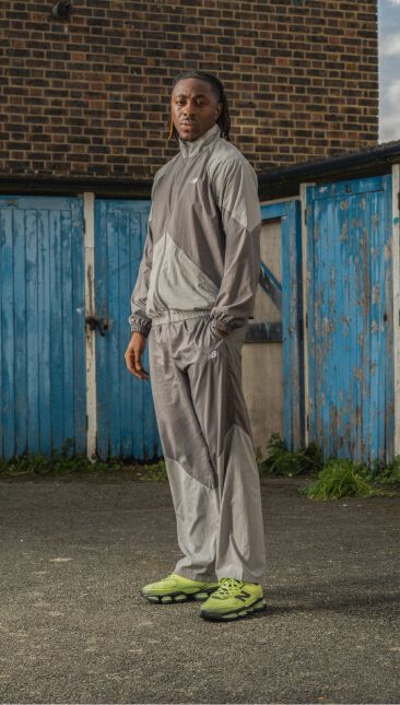 Eberechi Eze wearing the lime green shoes with his hands in his pockets