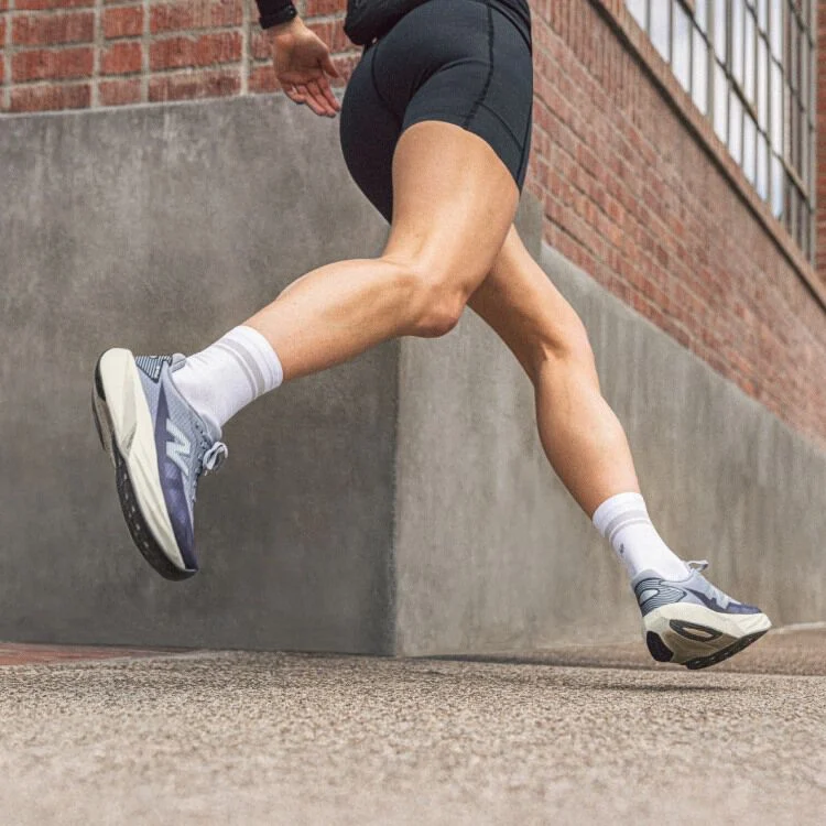 Knee down action shot of woman running