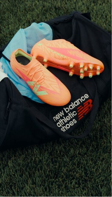 Furon cleats placed on top of a New Balance duffle bag.