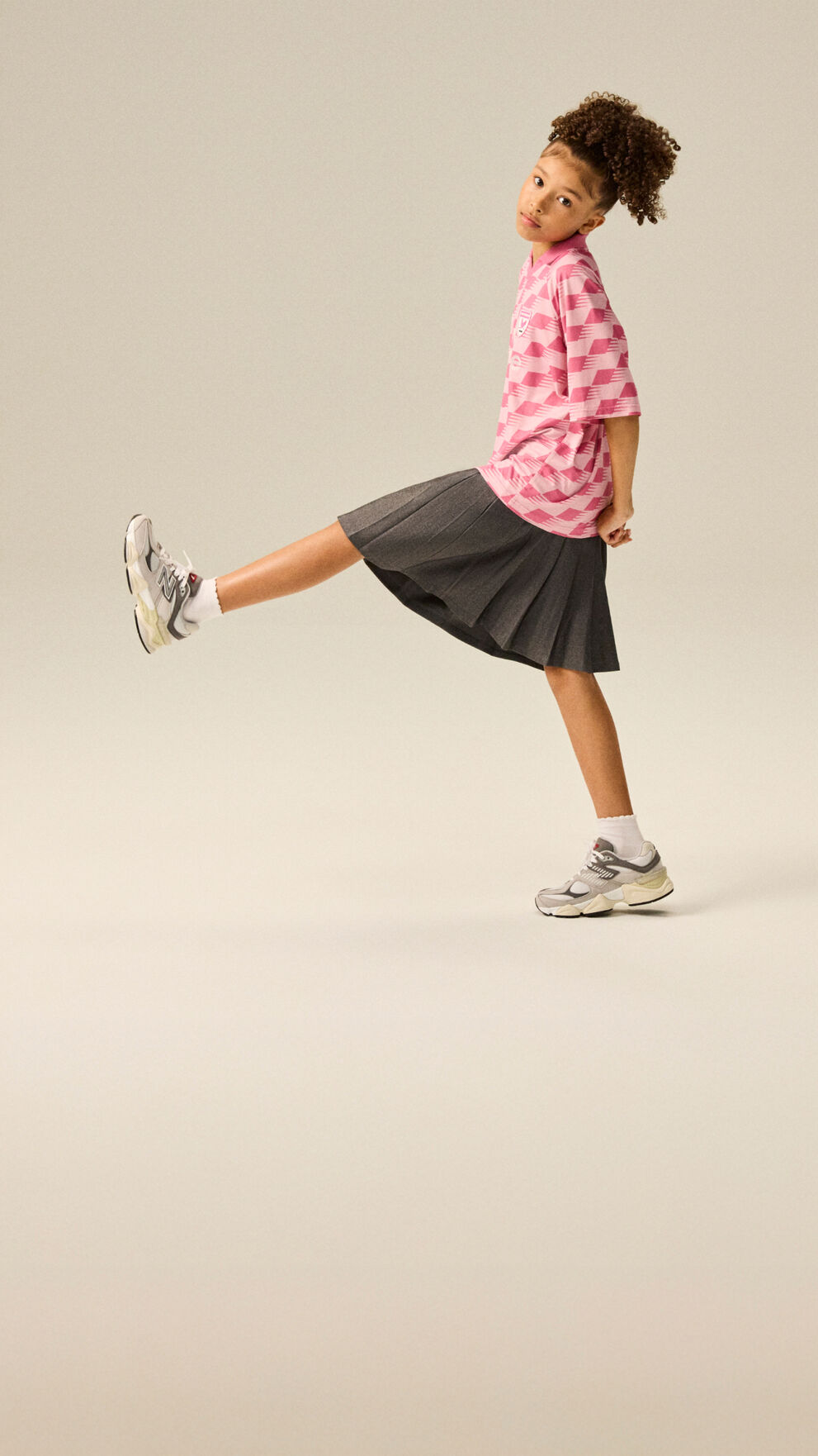 Girl wearing a pair of 9060 shoes.