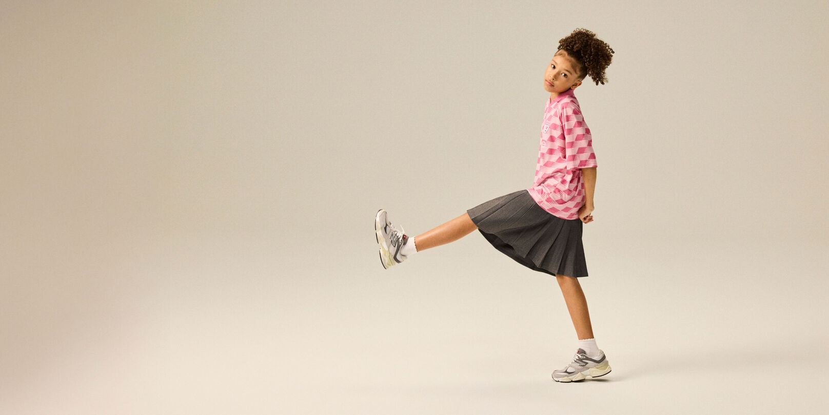 Girl wearing a pair of 9060 shoes.