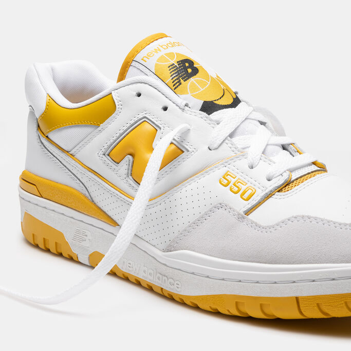 Detail shot of white and yellow old school basketball shoe