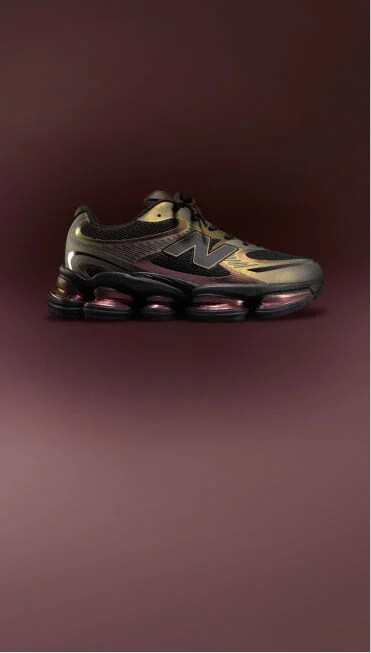 ABZORB 2000 shoes with a maroon background.