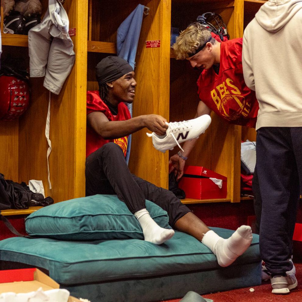 High school football players on a field.