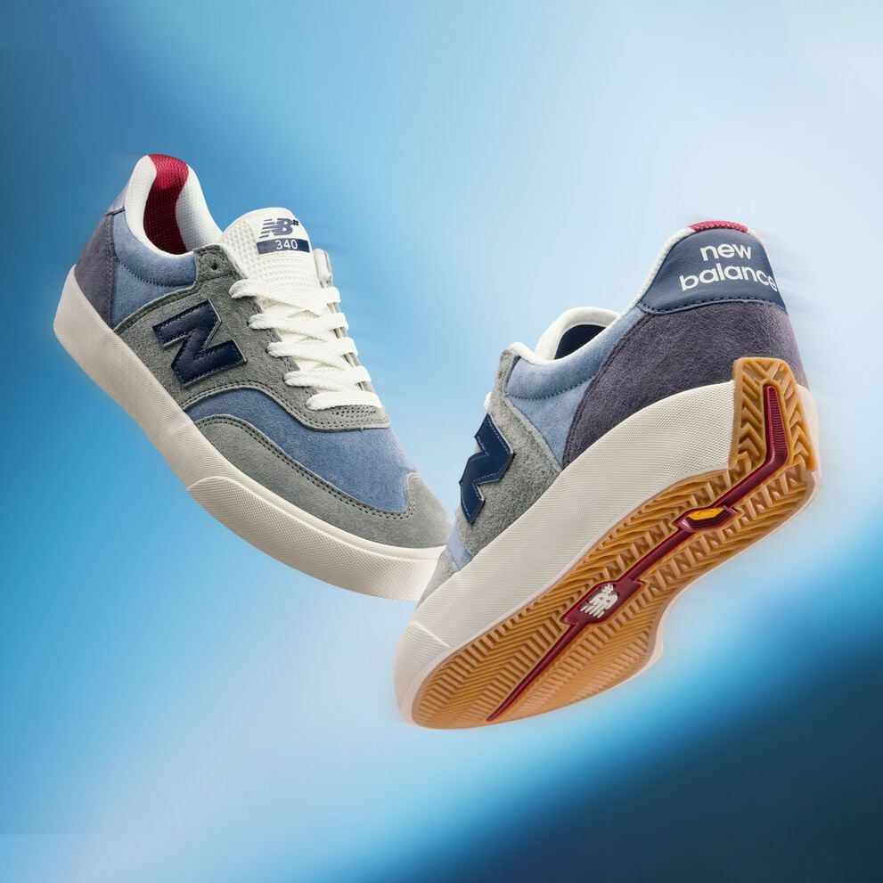 A pair of Numeric 340 shoes on a blue background.