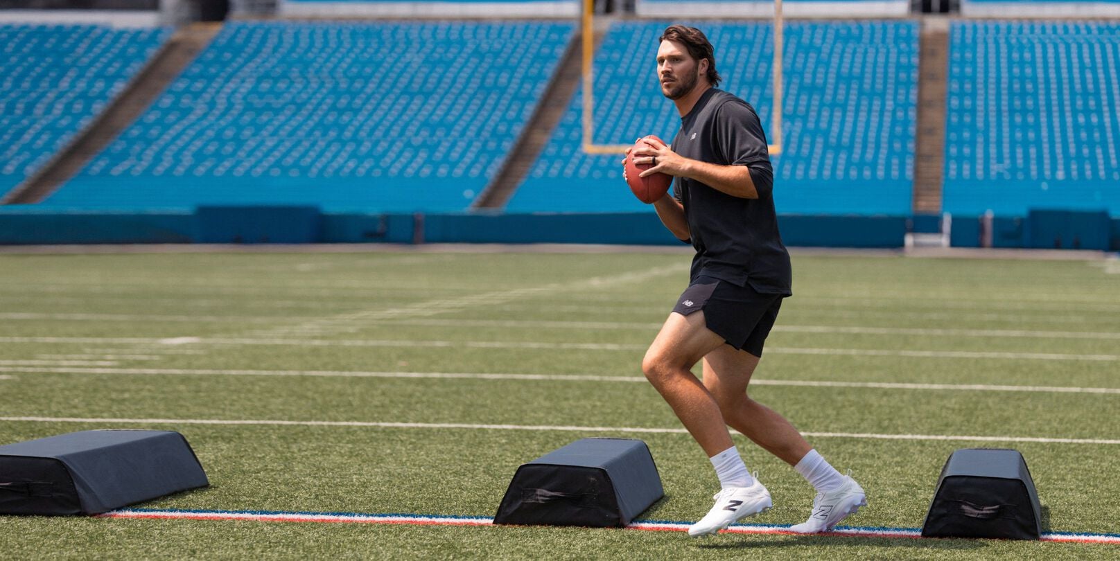 Josh Allen holding a football.