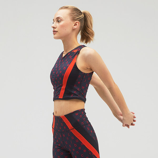 Young white female in a crop top stretching. 