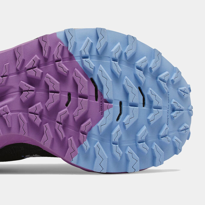 Bottom of the trail shoe focusing on the tread pattern.