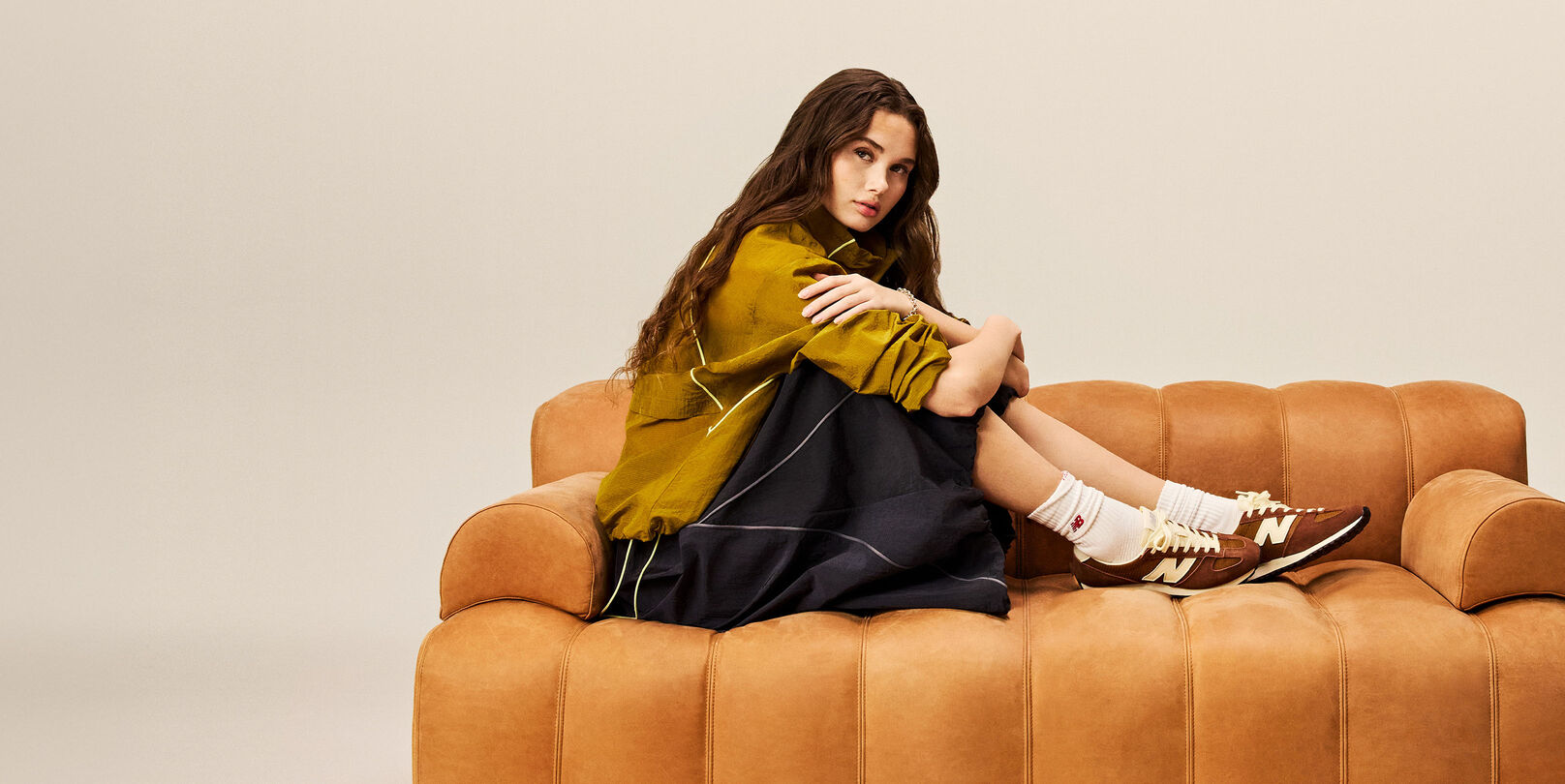 Girl wearing the 471 while sitting on a couch