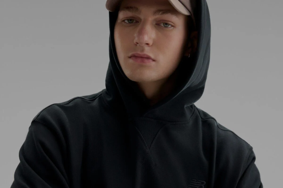 Close-up of a man wearing a black sweatshirt. 