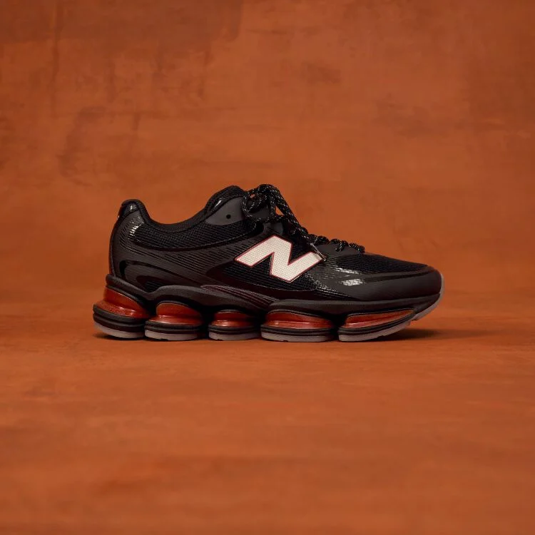 Side profile shot of black shoes with red accents.