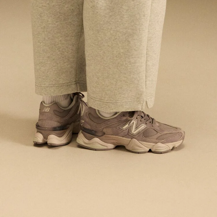 Side profile on-figure shot of the tan and beige shoes.