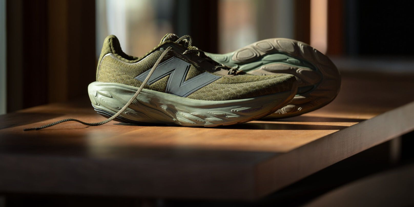 A pair of green 1080v14 shoes.