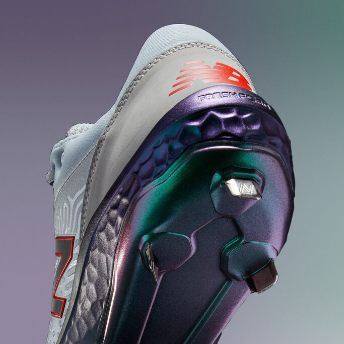 Back angle of the cleat showing the purple midsole.