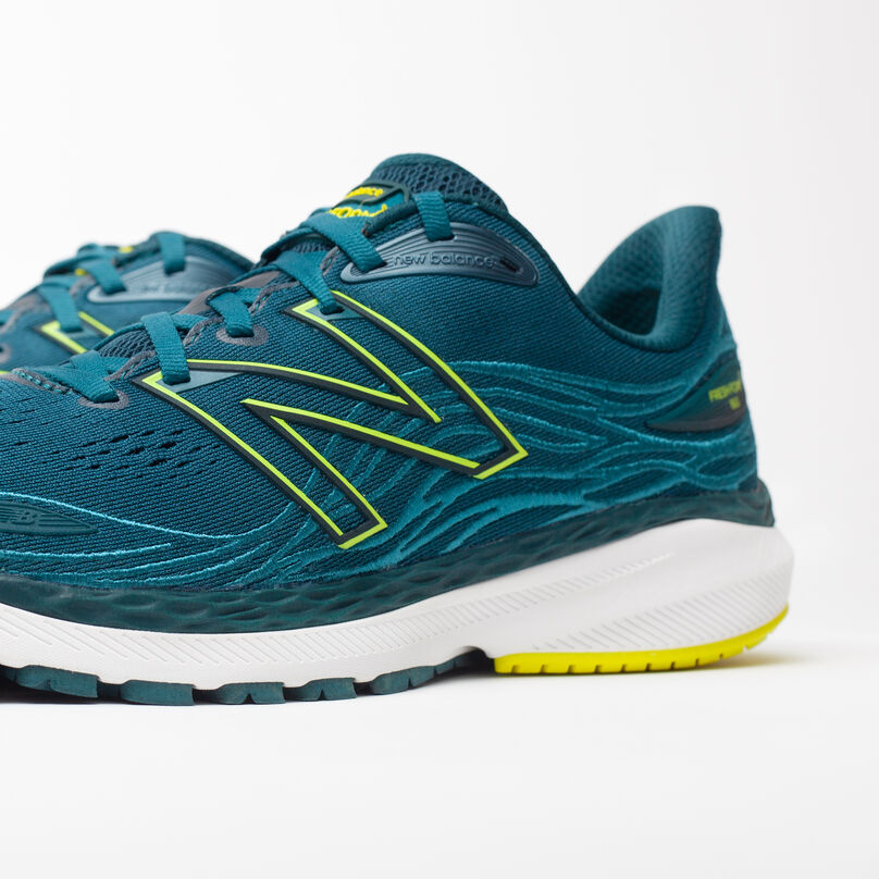 Zoomed in, side profile of dark green Fresh Foam X 860v12 with front upper cropped