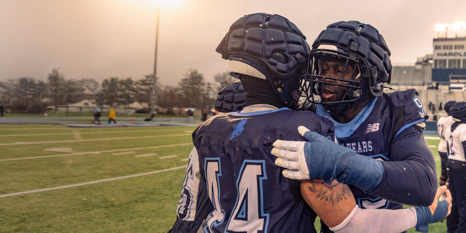 High school football players on a field.