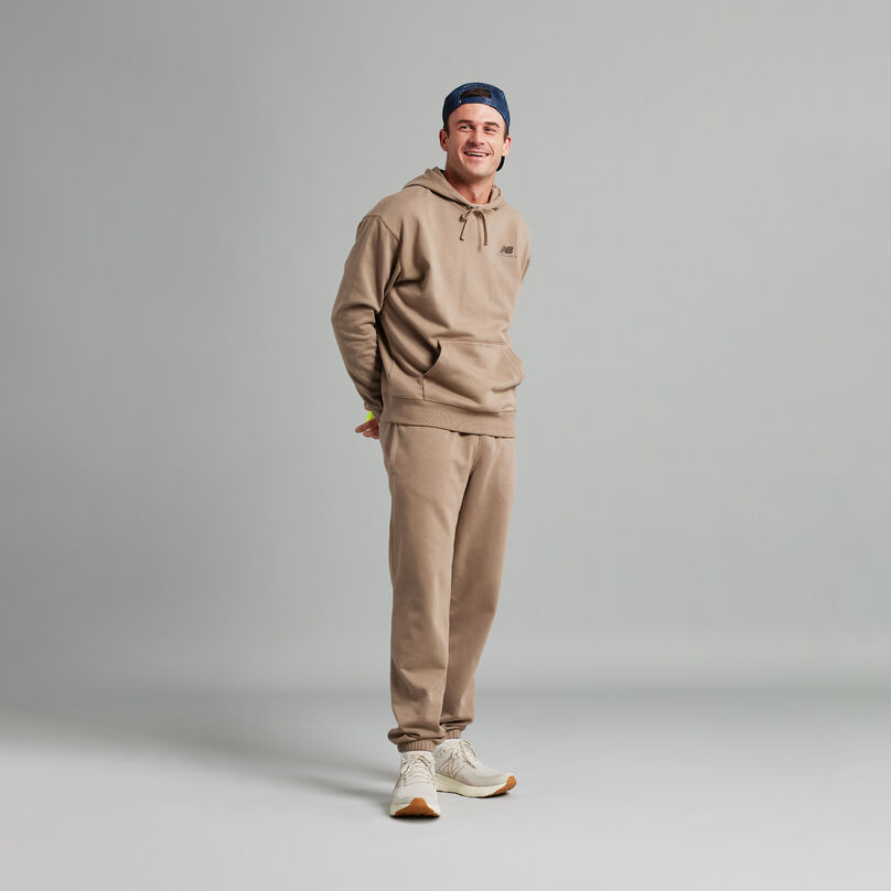 Tommy Paul standing in studio wearing tan and cream 1080v12 shoes.