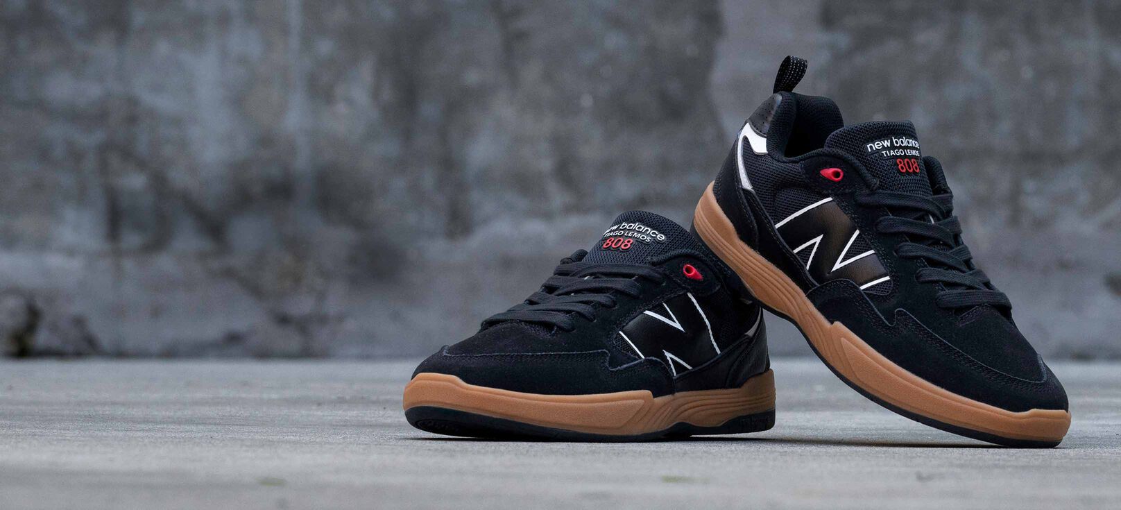 A pair of black and red Tiago 808 Lite shoes. 