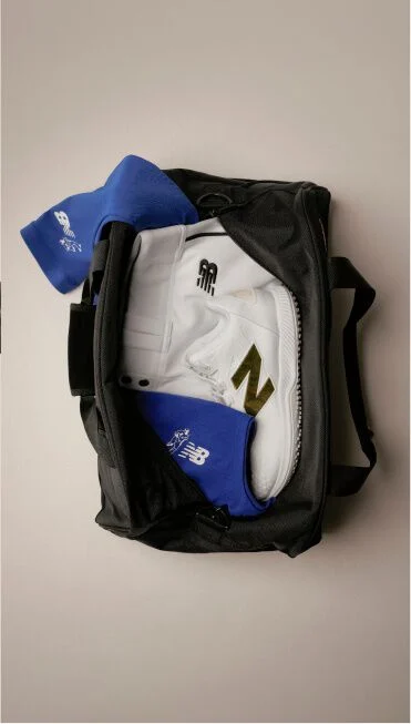 An open gym bag with 2026 Shohei Ohtani Signature Collection apparel and footwear inside.