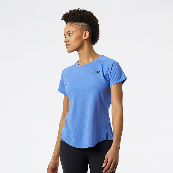 Woman wearing a light-blue NB short sleeve shirt and black tights