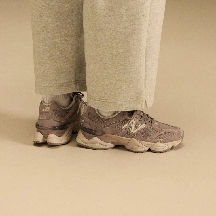 Side profile on-figure shot of the tan and beige shoes.