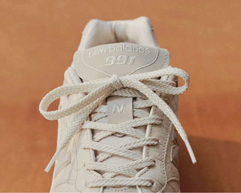 Close up view of a New Balance Made in UK sneaker tongue and laces.