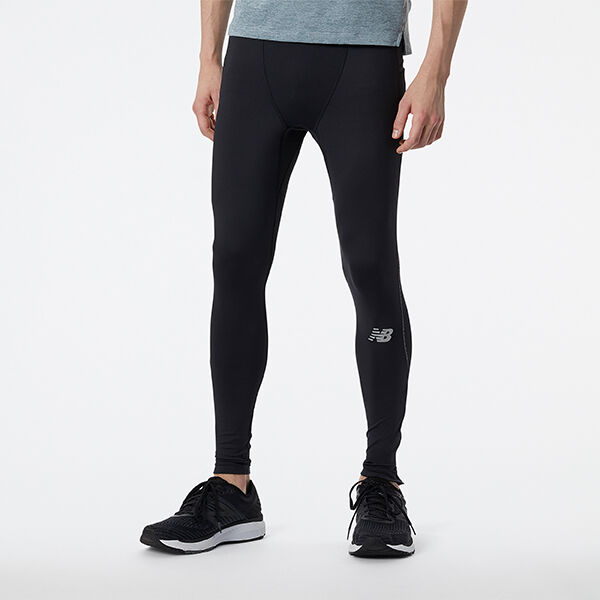 Black tights and black shoes on a young man. 